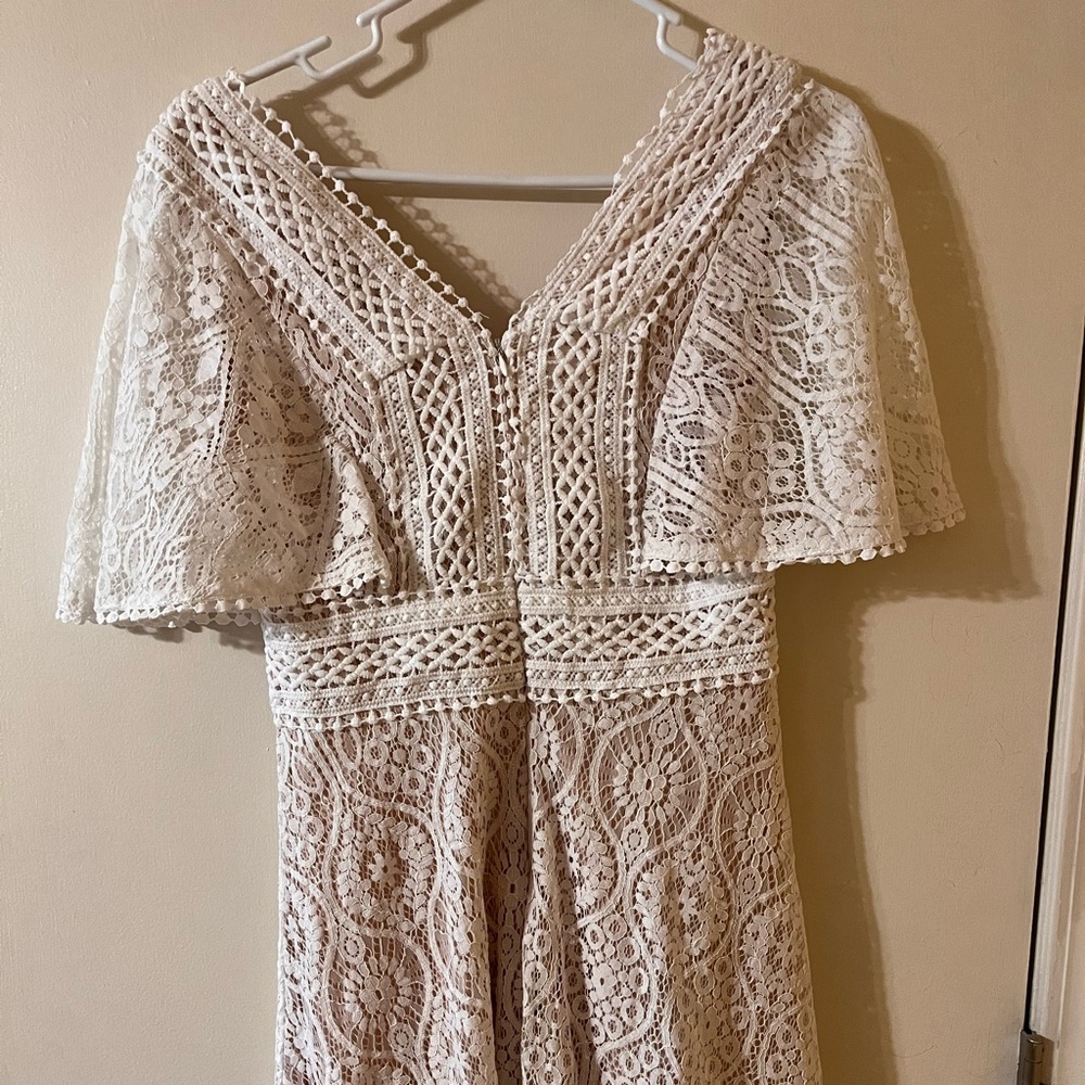Lulus white/cream colored dress. Lace detailing. Size medium and worn once!